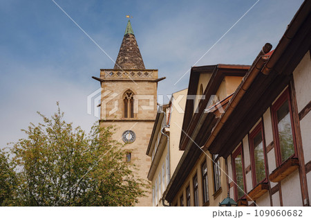 spring trip to Europe. Travel and German sightseeing locations. interesting ancient towers and facades of medieval houses somewhere in Erfurt city 109060682