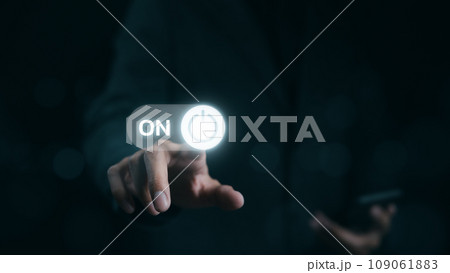 A businessman is shown in the act of touching a virtual toggle switch button, which is used to turn a device on or off. Slider button hologram, Startup business, A businessman is shown in the act of touching a virtual toggle switch button, which is used to turn a device on or off. Slider button hologram, Startup business, 109061883