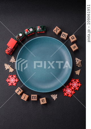 Beautiful Christmas composition with copy space with an inscription in wooden cubes Beautiful Christmas composition with copy space with an inscription in wooden cubes 109061951
