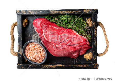 Fresh Raw veal meat with herbs and salt. Isolated, white background. 109063795