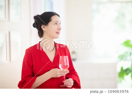 Asian woman at a party. Lady in elegant dress. 109063976