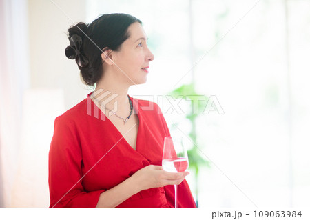 Asian woman at a party. Lady in elegant dress. 109063984