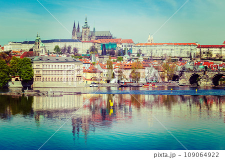 Vintage retro hipster style travel image of Charles bridge over Vltava river and Gradchany Prague Castle and St. Vitus Cathedral Vintage retro hipster style travel image of Charles bridge over Vltava river and Gradchany Prague Castle and St. Vitus Cathedral 109064922
