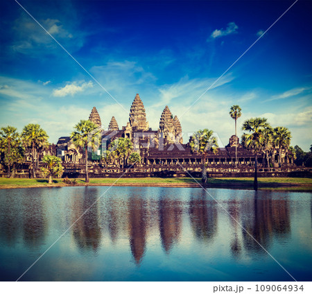 Vintage retro effect filtered hipster style travel image of Cambodia landmark Angkor Wat with reflection in water 109064934