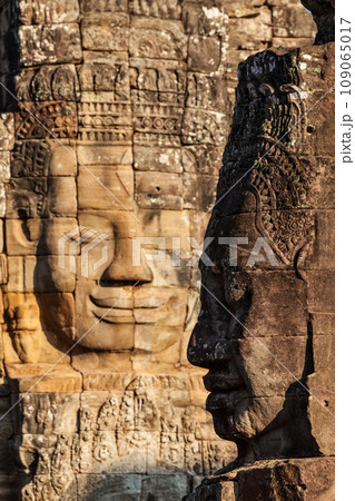 Ancient stone faces of Bayon temple, Angkor, Cambodia Ancient stone faces of Bayon temple, Angkor, Cambodia 109065017