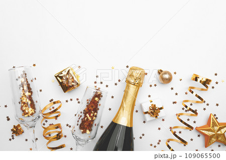 Christmas background with golden decoration on white background, space for text Christmas background with golden decoration on white background, space for text 109065500