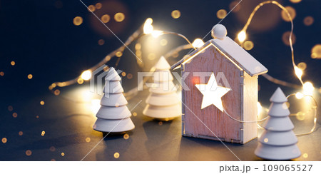 Christmas decorations with garland on dark background Christmas decorations with garland on dark background 109065527