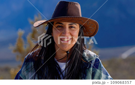 Young woman in a western style outfit exploring the amazing Red Rock Canyon in Nevada 109068357