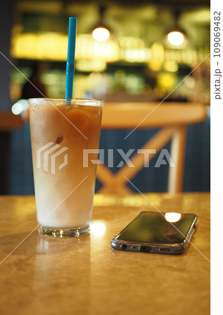 iced late in a transparent glass on cafe table outdoor  109069482