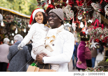 Happy man with joyful daughter Christmas fair Happy man with joyful daughter Christmas fair 109069905