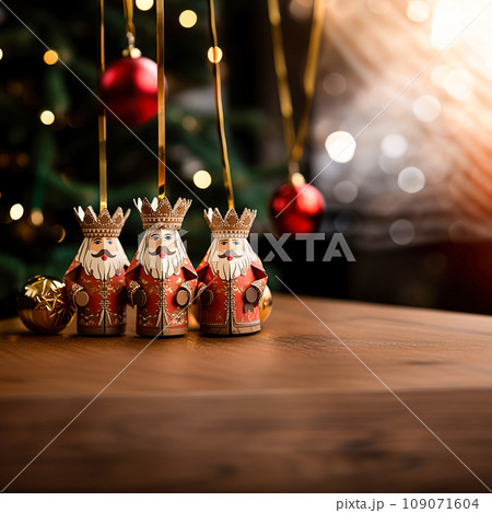 Christmas tree decorations in the form of the Three Wise Men against, sparkling bokeh. Religious holiday of Epiphany 109071604