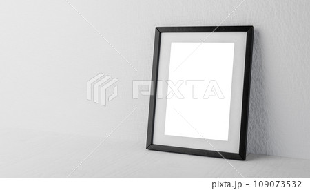 photo frame mockup against neutral plaster background. black photo frame mockup with blank white sheet on gray shelf photo frame mockup against neutral plaster background. black photo frame mockup with blank white sheet on gray shelf 109073532