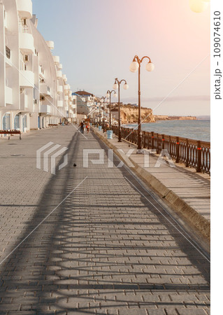 Coastal residential areas with a modern hotel and restaurant complex alongside sandy beaches. Summer holiday vacation and travel concept. Coastal residential areas with a modern hotel and restaurant complex alongside sandy beaches. Summer holiday vacation and travel concept. 109074610