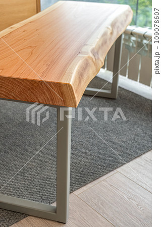 Live edge wooden bench with gray metal legs Live edge wooden bench with gray metal legs 109078607