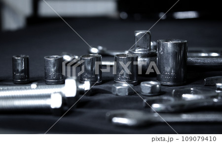 Variety Hardware Products On Black Workbench Closeup Angle View  109079410