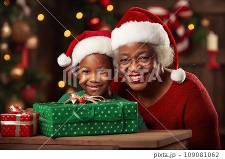 African grandmother and granddaughter celebrating Christmas African grandmother and granddaughter celebrating Christmas 109081062