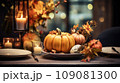 Thanksgiving table setting with pumpkin 109081300