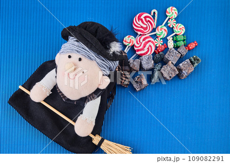 The Befana with sweet coal and candy. Italian Epiphany day tradition. The Befana with sweet coal and candy. Italian Epiphany day tradition. 109082291