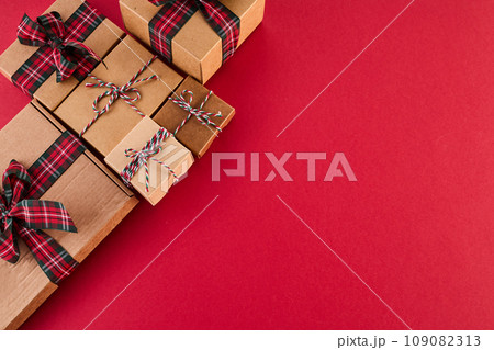 Boxing Day Concept. Different kinds of gift boxes on red background Boxing Day Concept. Different kinds of gift boxes on red background 109082313