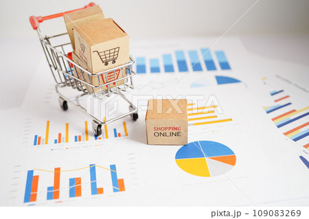Online shopping, Shopping cart box on business graph, import export, finance commerce. Online shopping, Shopping cart box on business graph, import export, finance commerce. 109083269