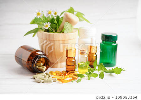 Alternative medicine herbal organic capsule with vitamin E omega 3 fish oil, mineral, drug with herbs leaf natural supplements for healthy good life. 109083364