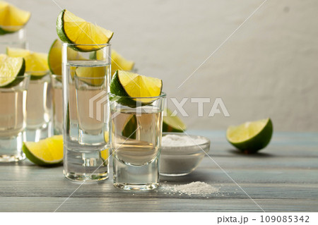 Tequila with salt and lime. Tequila with salt and lime. 109085342