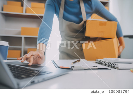 Business woman start up small business entrepreneur SME success .freelance woman working at home with Online Parcel delivery. SME and packaging deliveryconcept Business woman start up small business entrepreneur SME success .freelance woman working at home with Online Parcel delivery. SME and packaging deliveryconcept 109085794