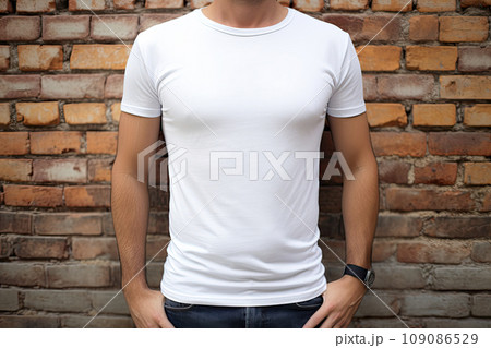 Man wearing blank t-shirt. Brick wall background Man wearing blank t-shirt. Brick wall background 109086529