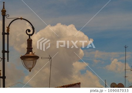 The appearance of a rising large cloud of smoke from a fire or explosion on the far side of the city. Dangerous consequences of a man-made disaster, symptoms 109087033