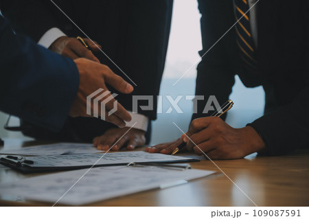 Consultation and conference of Male lawyers and professional businesswoman working and discussion having at law firm in office. Concepts of law, Judge gavel with scales of justice. 109087591