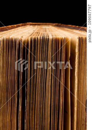 ancient book shot on black background 109087797