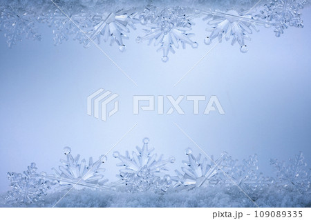 Blue Christmas snowflakes background. Winter background with snowflakes. Blue Christmas snowflakes background. Winter background with snowflakes. 109089335