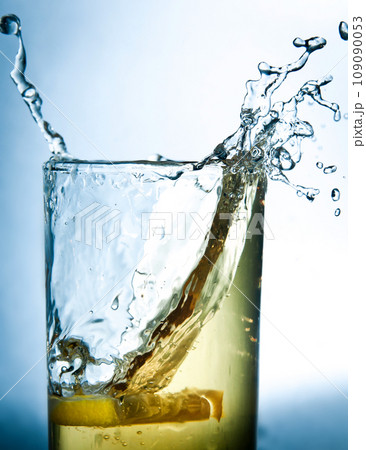 lemon drops in a glass of drink 109090053