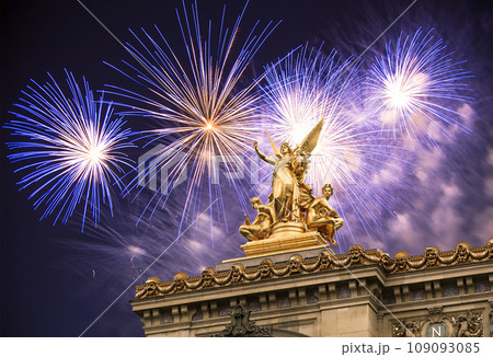 Fireworks over the Golden statue of Liberty on the roof of the Opera Garnier (Garnier Palace). Sculpted by Charles Gumery in 1869. Paris, France. UNESCO World Heritage Site 109093085