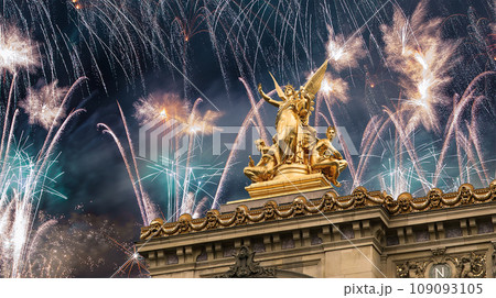 Fireworks over the Golden statue of Liberty on the roof of the Opera Garnier (Garnier Palace). Sculpted by Charles Gumery in 1869. Paris, France. UNESCO World Heritage Site 109093105