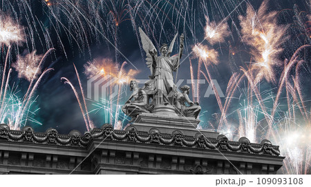 Fireworks over the Golden statue of Liberty on the roof of the Opera Garnier (Garnier Palace). Sculpted by Charles Gumery in 1869. Paris, France. UNESCO World Heritage Site 109093108