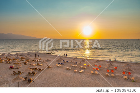 Sarande beach during sunset. Bistrica Beach with view at Sarande city. beautiful evening sky 109094330
