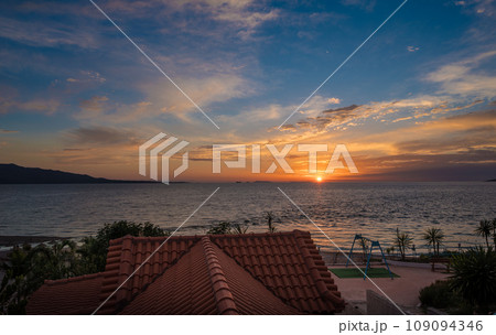 Sarande beach during sunset. Bistrica Beach with view at Sarande city. beautiful evening sky 109094346