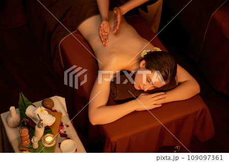 Caucasian woman customer enjoying relaxing anti-stress massage. Quiescent Caucasian woman customer enjoying relaxing anti-stress massage. Quiescent 109097361