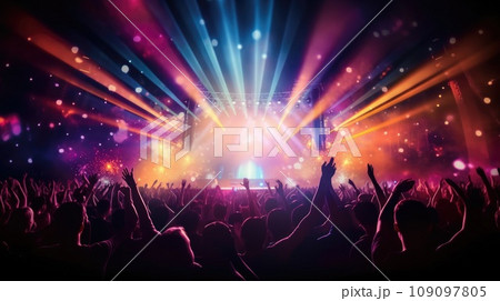 silhouette of concert crowd in front of bright stage lights 109097805