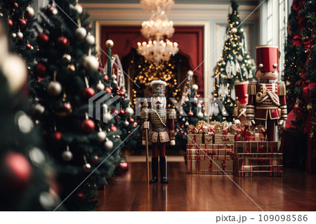 Classic Nutcracker soldier in full regalia, standing against a backdrop of Christmas decorations. The focus is on the intricate details of the Nutcrackers uniform and the festive ambiance around it. 109098586