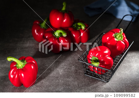 red peppers in wooden box 109099582