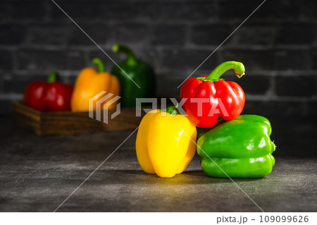 colorful bell peppers on dark background 109099626