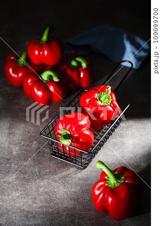 red peppers in wooden box 109099700