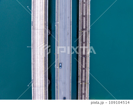 Aerial top view drone shot of bridge with cars on bridge road image transportation background concept,Aerial view of sarasin bridge in Phuket Thailand transportation background,Top view 109104514