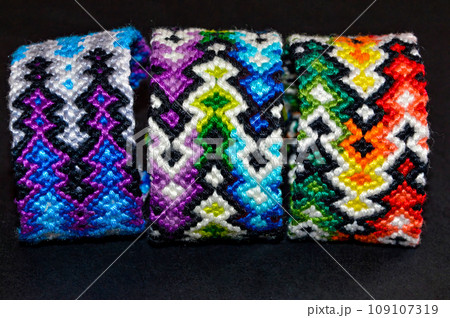 DIY woven tied friendship bracelet with unusual braiding. Summer accessory 109107319
