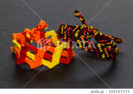 DIY woven tied friendship bracelet with unusual braiding. Summer accessory DIY woven tied friendship bracelet with unusual braiding. Summer accessory 109107333