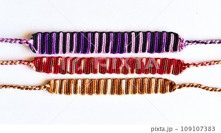 DIY woven tied friendship bracelet with unusual braiding. Summer accessory DIY woven tied friendship bracelet with unusual braiding. Summer accessory 109107383