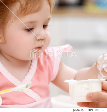 laughing eating baby girl with dirty face laughing eating baby girl with dirty face 109108095