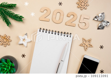 New Year Aims 2025. To Do List. Empty Notebook at the Desk with Holiday Decoration. Top view. Creating Plan, Resolution. New Life, Start Up, Beginning Concept. Business ideas. Goals, action, checklist New Year Aims 2025. To Do List. Empty Notebook at the Desk with Holiday Decoration. Top view. Creating Plan, Resolution. New Life, Start Up, Beginning Concept. Business ideas. Goals, action, checklist 109111091